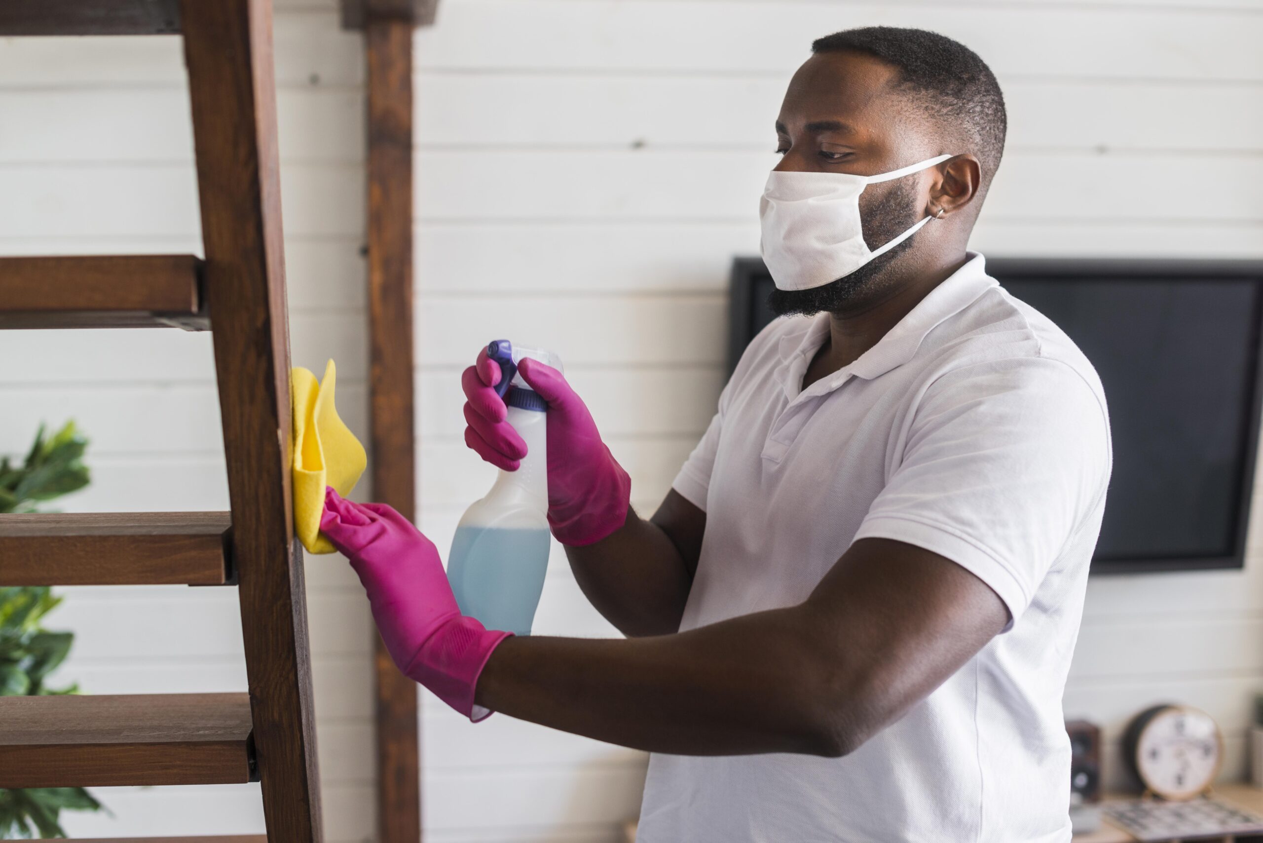 handsome-man-cleaning-house